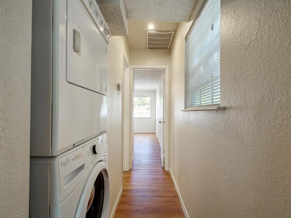 4906 Duval Street, Unit A Austin, TX 78751 - Photo 18 of 24 a view of a hallway with washer and dryer