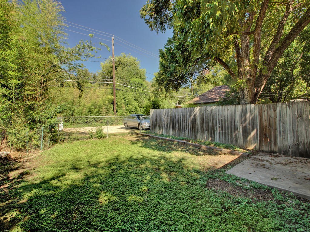4906 Duval Street, Unit A Austin, TX 78751 - Photo 19 of 24 a backyard of a house with lots of green space