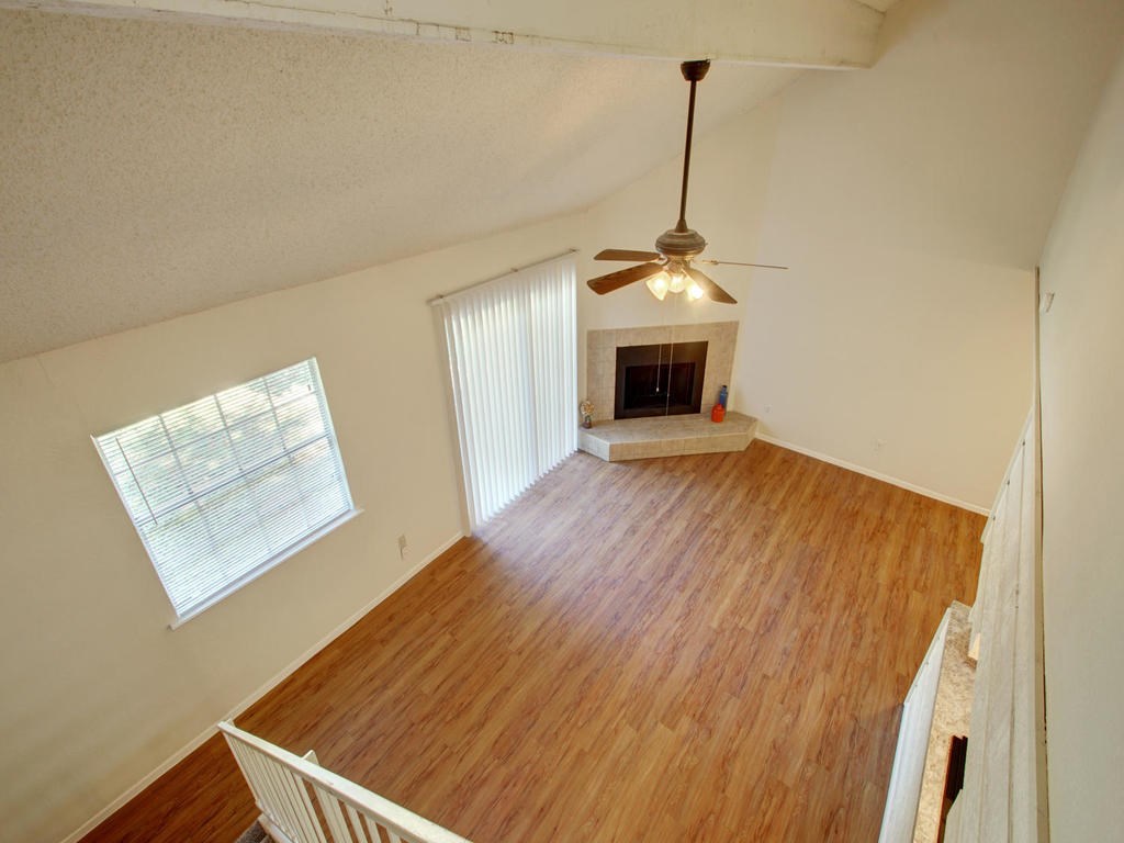4906 Duval Street, Unit A Austin, TX 78751 - Photo 8 of 24 a view of a room with wooden floor and fireplace