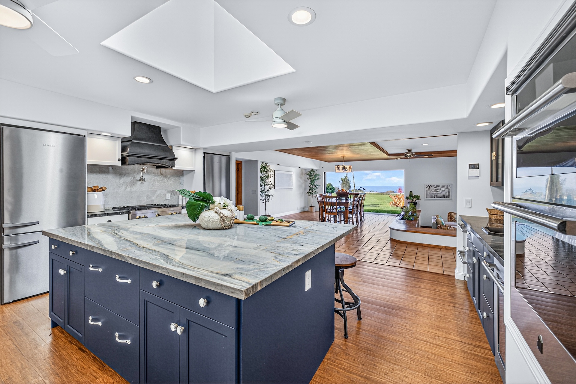 56-2878 Puakea Bay Road Kamuela, HI 96743 - Photo 15 of 25 a kitchen with granite countertop a oven a stove and a refrigerator
