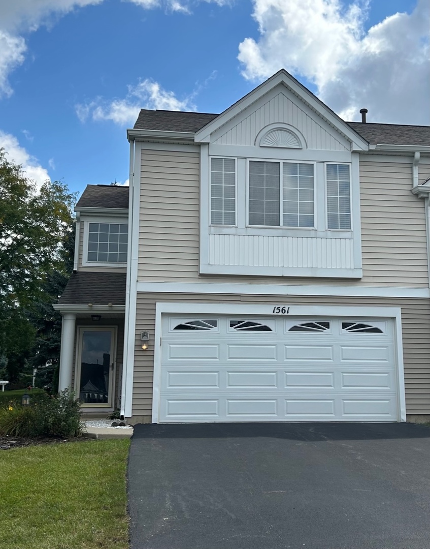 1561 Spaulding Road Bartlett, IL 60103 - Photo 1 of 25 a view of a house with a yard