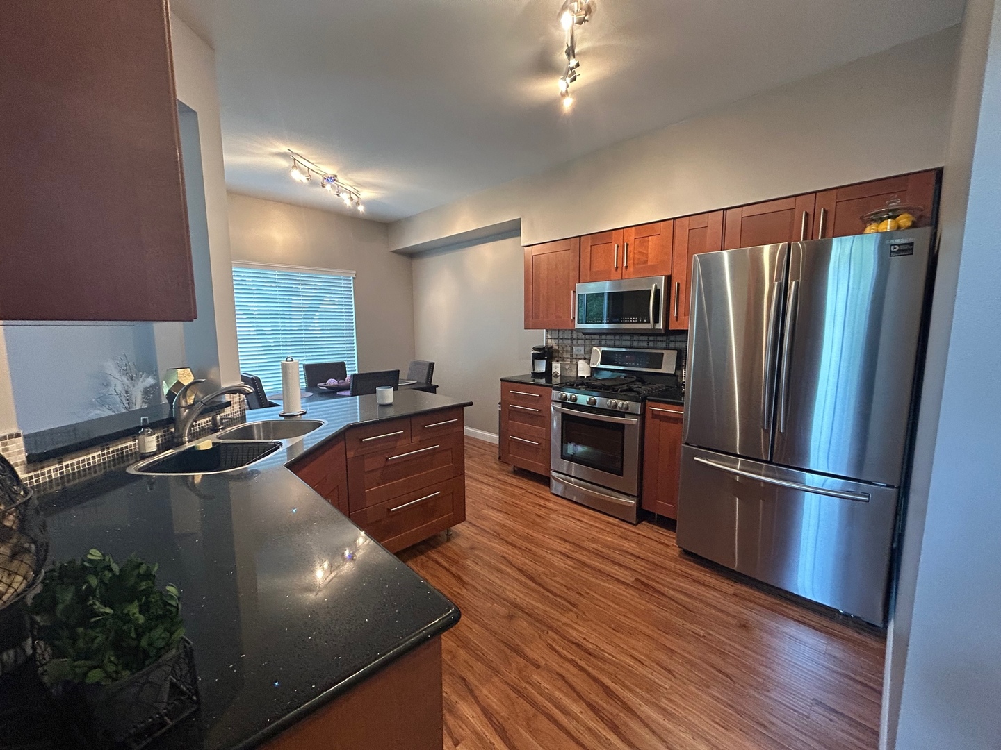 1561 Spaulding Road Bartlett, IL 60103 - Photo 11 of 25 a kitchen with stainless steel appliances granite countertop a refrigerator a sink dishwasher a stove and a refrigerator
