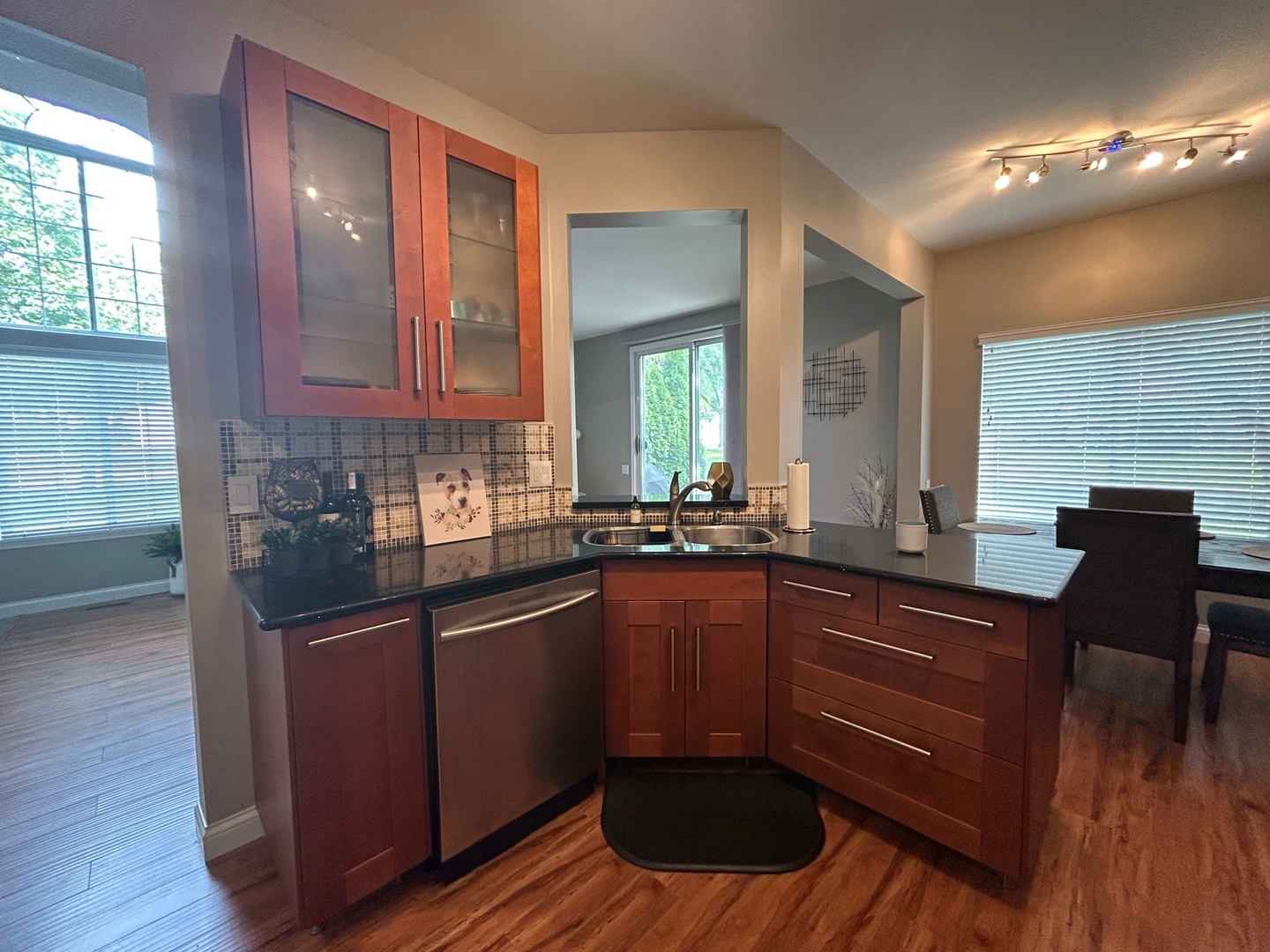 1561 Spaulding Road Bartlett, IL 60103 - Photo 13 of 25 a kitchen with a sink cabinets and wooden floor