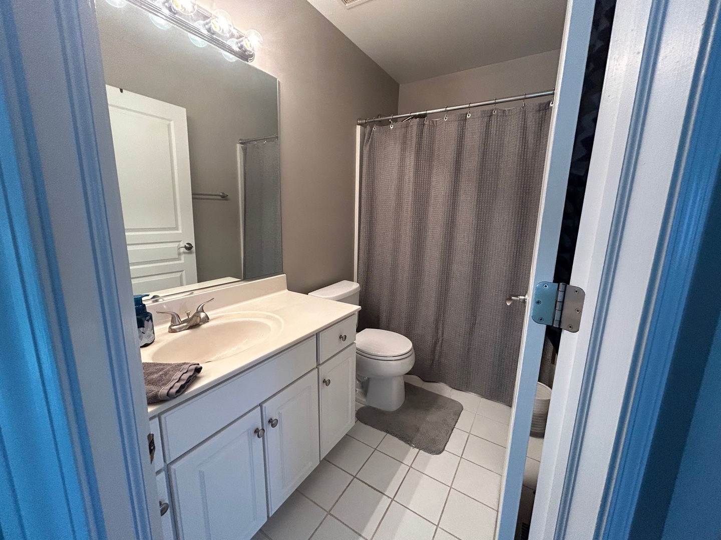 1561 Spaulding Road Bartlett, IL 60103 - Photo 18 of 25 a bathroom with a granite countertop sink and a mirror