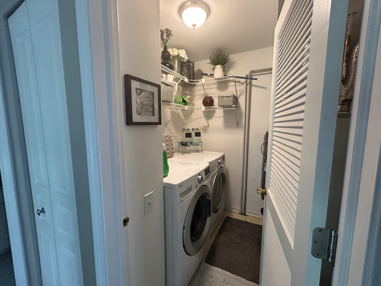 1561 Spaulding Road Bartlett, IL 60103 - Photo 19 of 25 a bathroom with a sink a washer and dryer