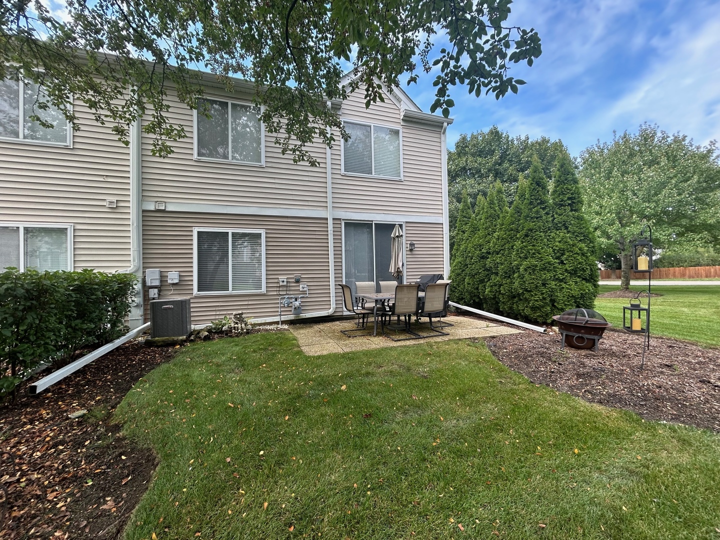 1561 Spaulding Road Bartlett, IL 60103 - Photo 24 of 25 a view of a house with backyard and sitting area