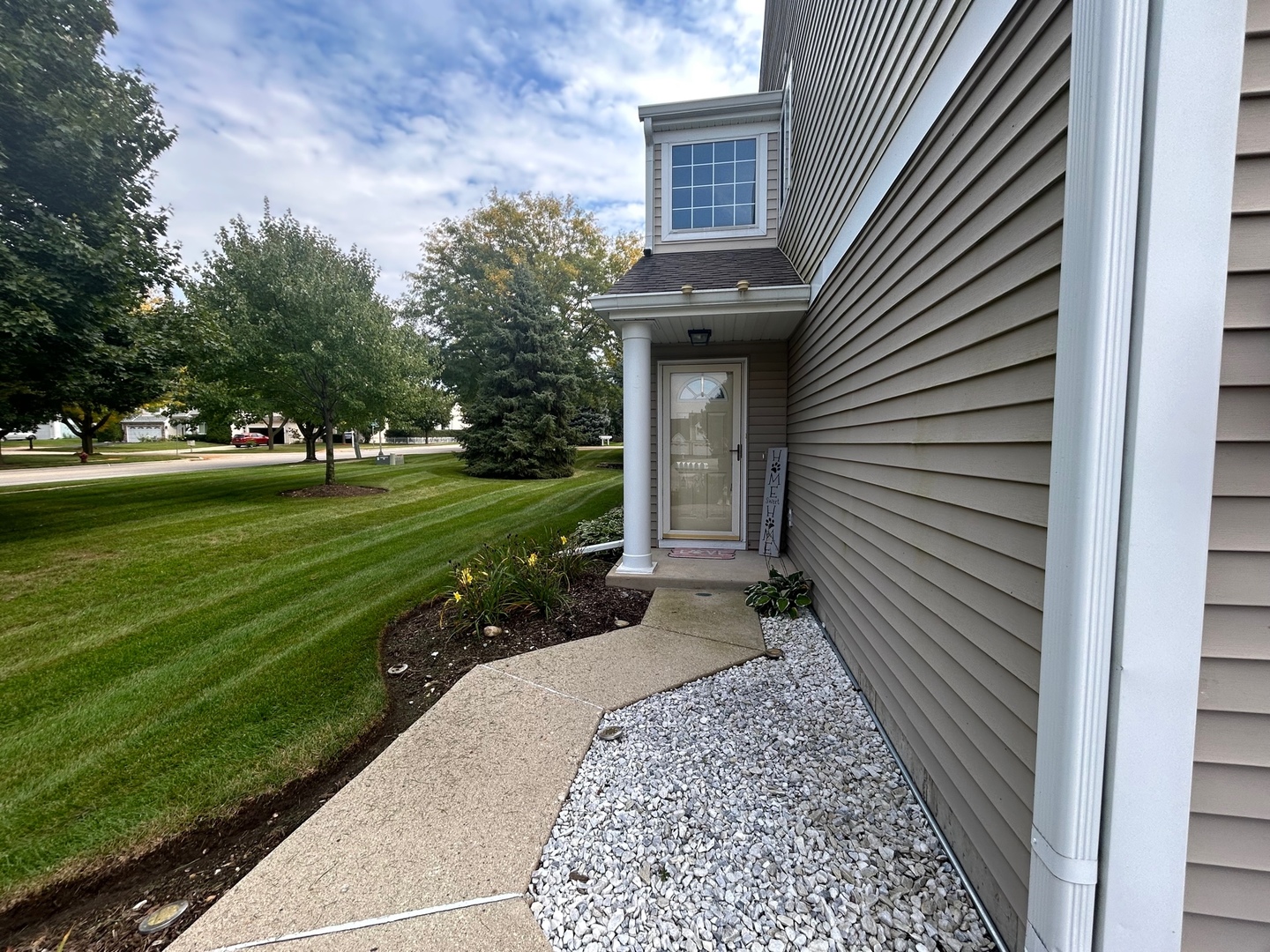 1561 Spaulding Road Bartlett, IL 60103 - Photo 3 of 25 a view of a house with a small garden