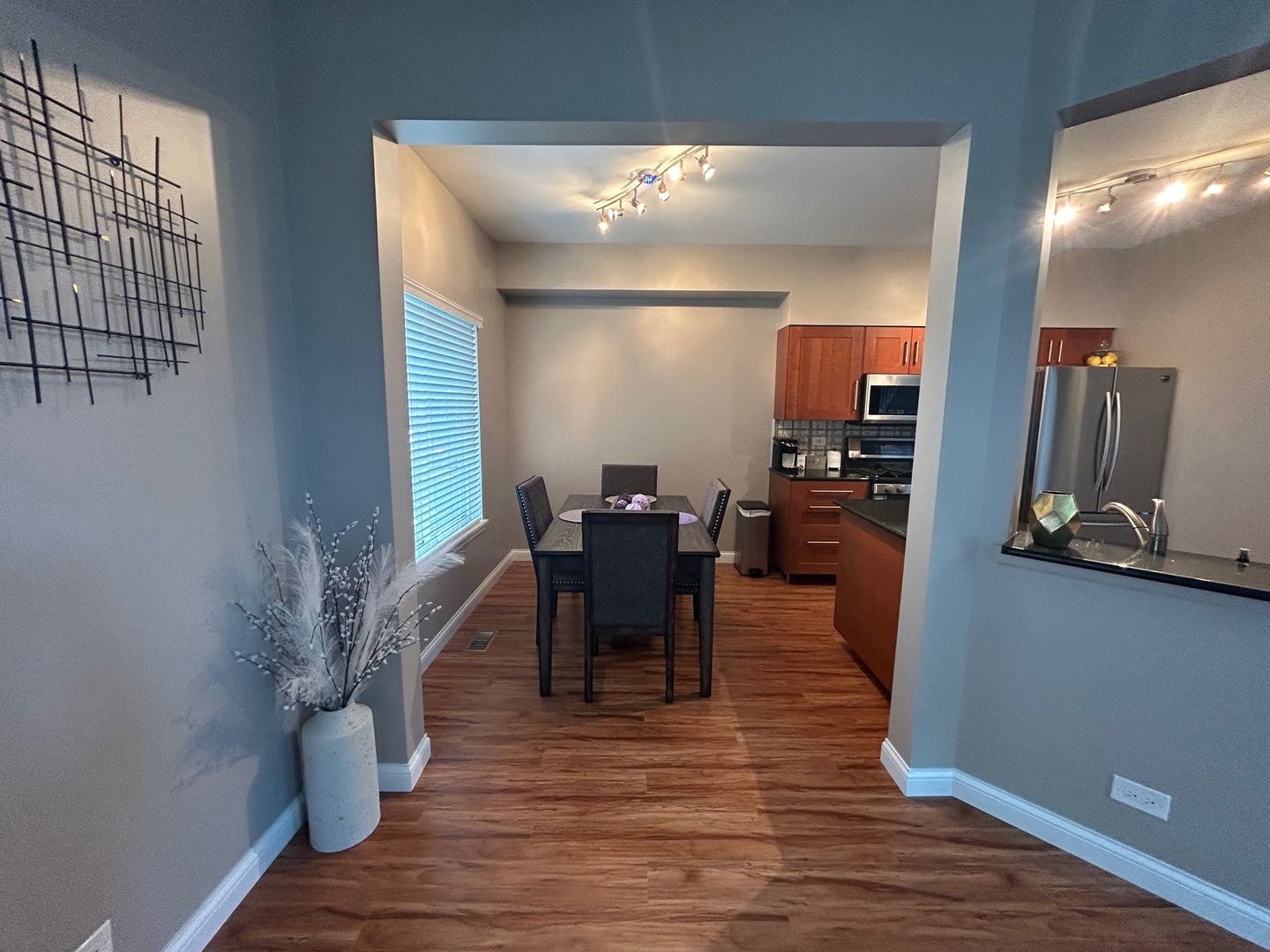 1561 Spaulding Road Bartlett, IL 60103 - Photo 8 of 25 a view of a dining room with furniture window and wooden floor