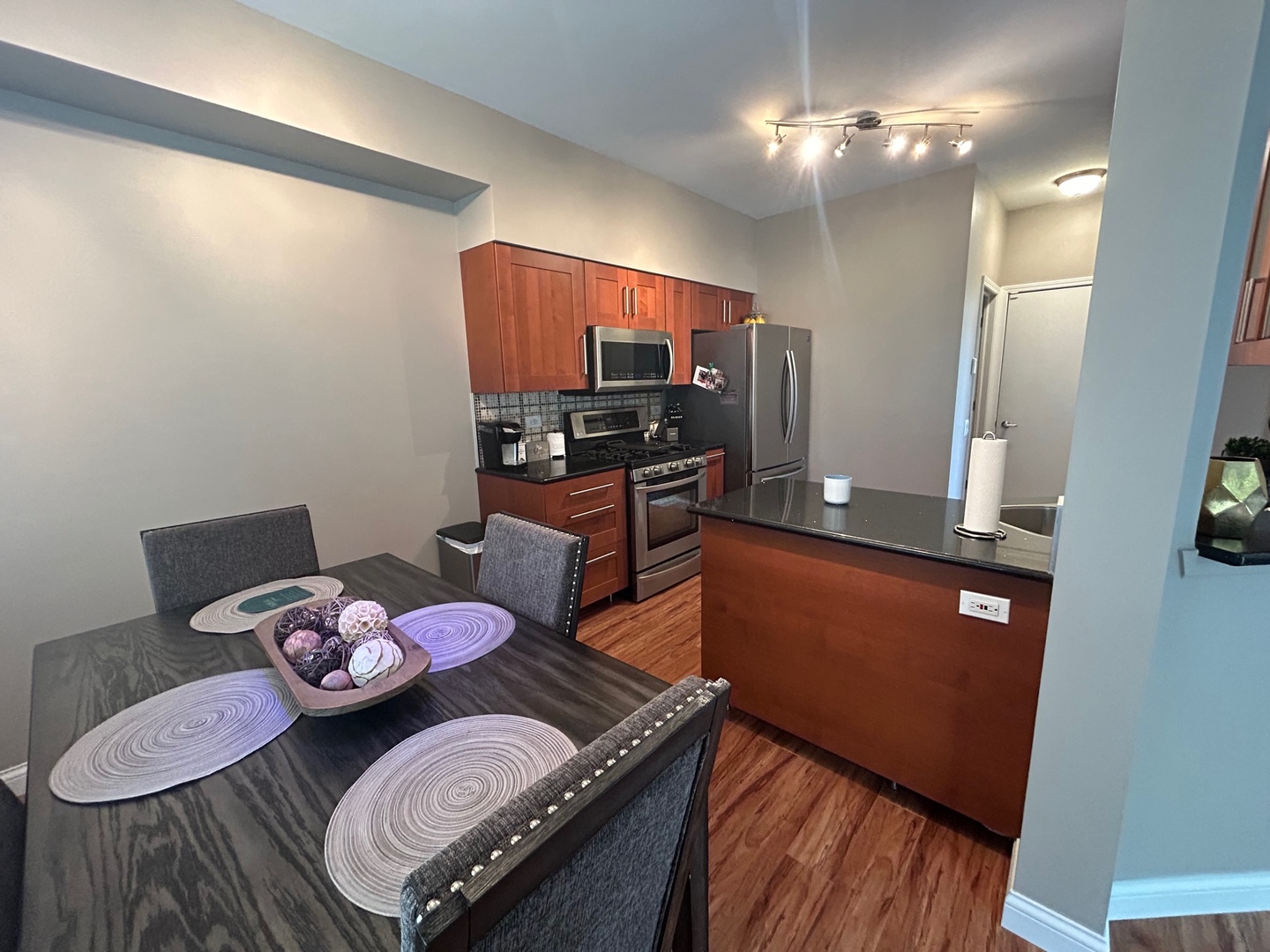 1561 Spaulding Road Bartlett, IL 60103 - Photo 9 of 25 a view of a dining room with furniture and wooden floor