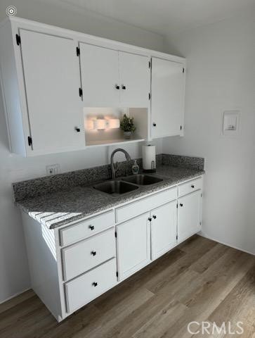 2008 Griffin Avenue, Unit 2 Los Angeles, CA 90031 - Photo 3 of 7 a kitchen with granite countertop white cabinets and white appliances
