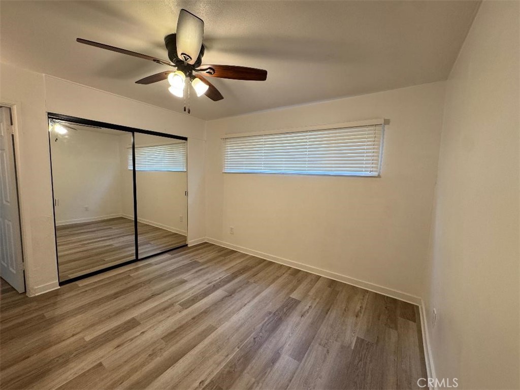 2008 Griffin Avenue, Unit 2 Los Angeles, CA 90031 - Photo 4 of 7 a view of an empty room with wooden floor and a ceiling fan