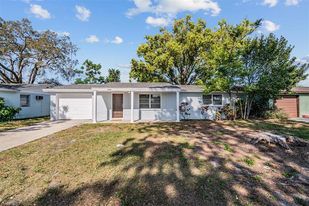 3643 Bedford Street New Port Richey, FL 34652 - Photo 1 of 1 front view of a house with a tree