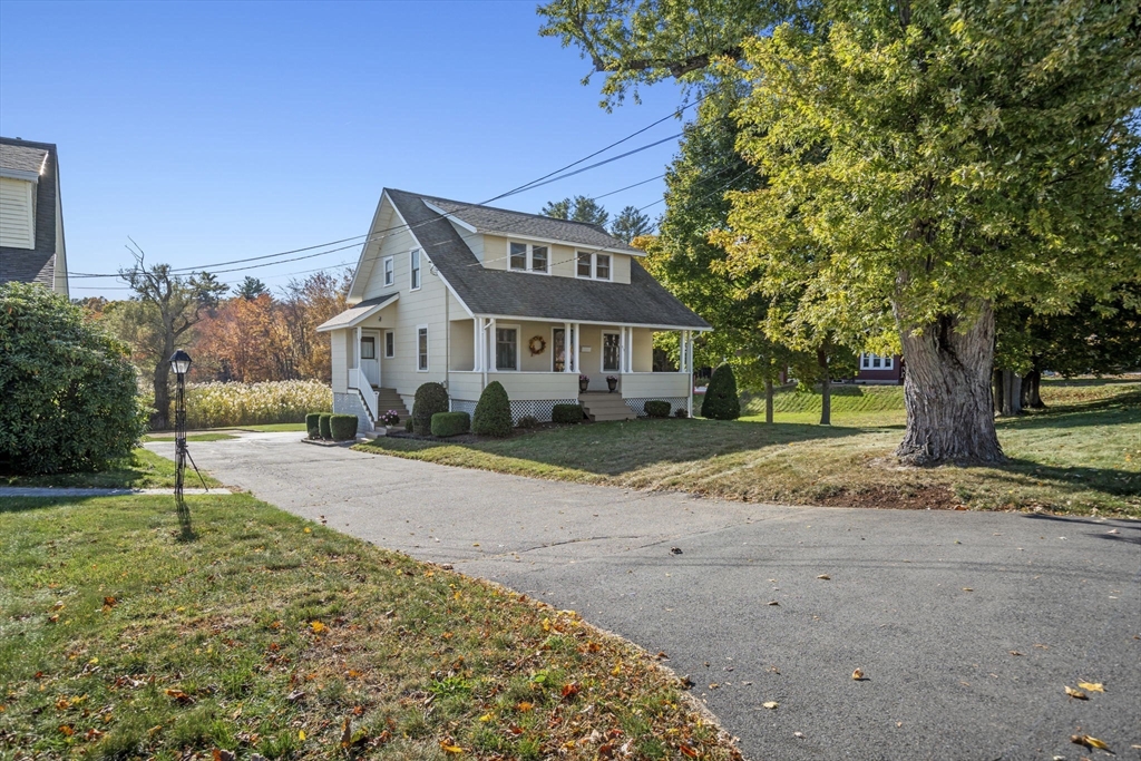 212 Elm Street Amesbury, MA 01913 - Photo 1 of 41 a front view of a house with a yard