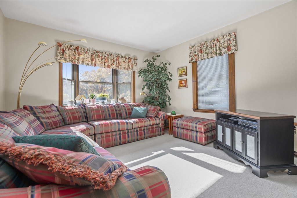 212 Elm Street Amesbury, MA 01913 - Photo 11 of 41 a living room with furniture and a large window