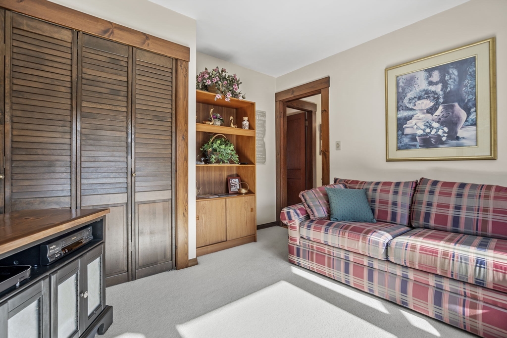 212 Elm Street Amesbury, MA 01913 - Photo 12 of 41 a living room with furniture and a window