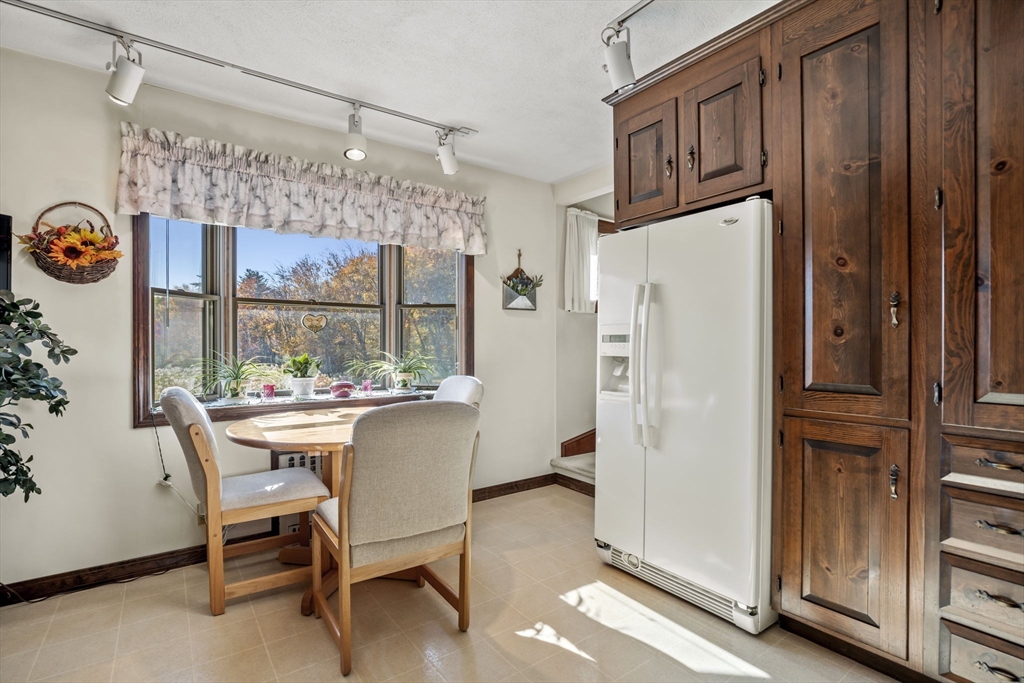 212 Elm Street Amesbury, MA 01913 - Photo 14 of 41 a kitchen with refrigerator and window