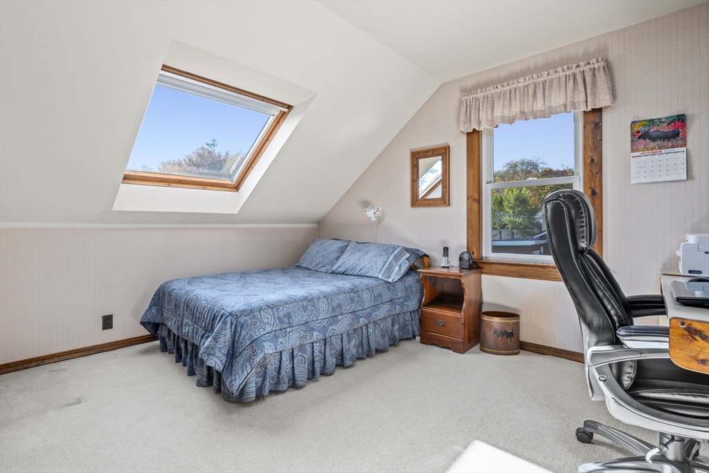 212 Elm Street Amesbury, MA 01913 - Photo 21 of 41 a bedroom with a bed and a large window