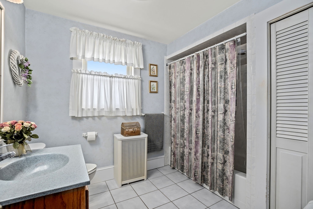 212 Elm Street Amesbury, MA 01913 - Photo 22 of 41 a bathroom with a sink toilet and shower
