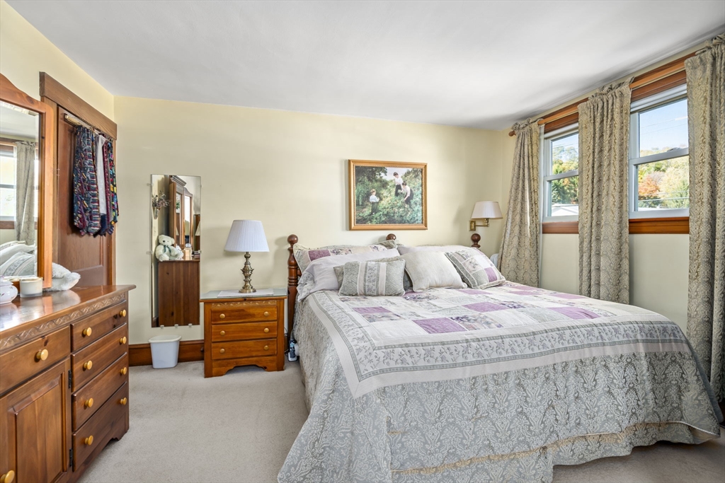 212 Elm Street Amesbury, MA 01913 - Photo 24 of 41 a bedroom with a bed and dresser