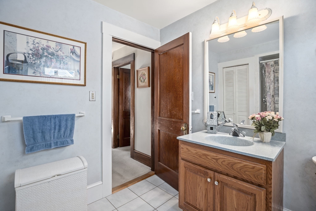 212 Elm Street Amesbury, MA 01913 - Photo 26 of 41 a bathroom with a sink a toilet and shower