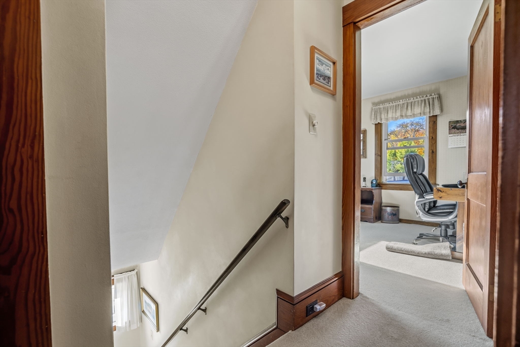 212 Elm Street Amesbury, MA 01913 - Photo 28 of 41 a en suite bathroom with a sink a mirror and a shower