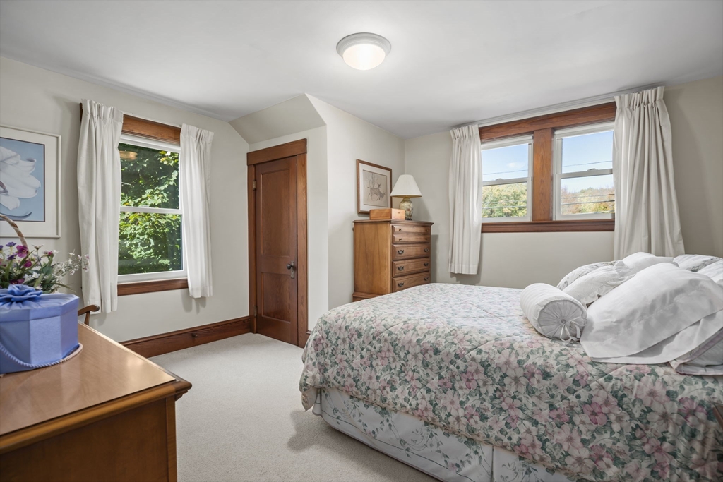 212 Elm Street Amesbury, MA 01913 - Photo 29 of 41 a bedroom with a bed and window