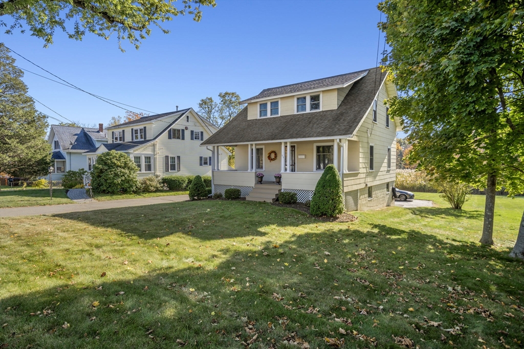 212 Elm Street Amesbury, MA 01913 - Photo 33 of 41 a front view of a house with a yard