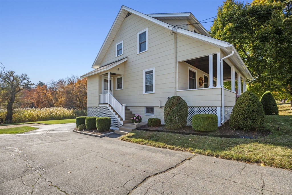 212 Elm Street Amesbury, MA 01913 - Photo 35 of 41 a front view of a house with garden