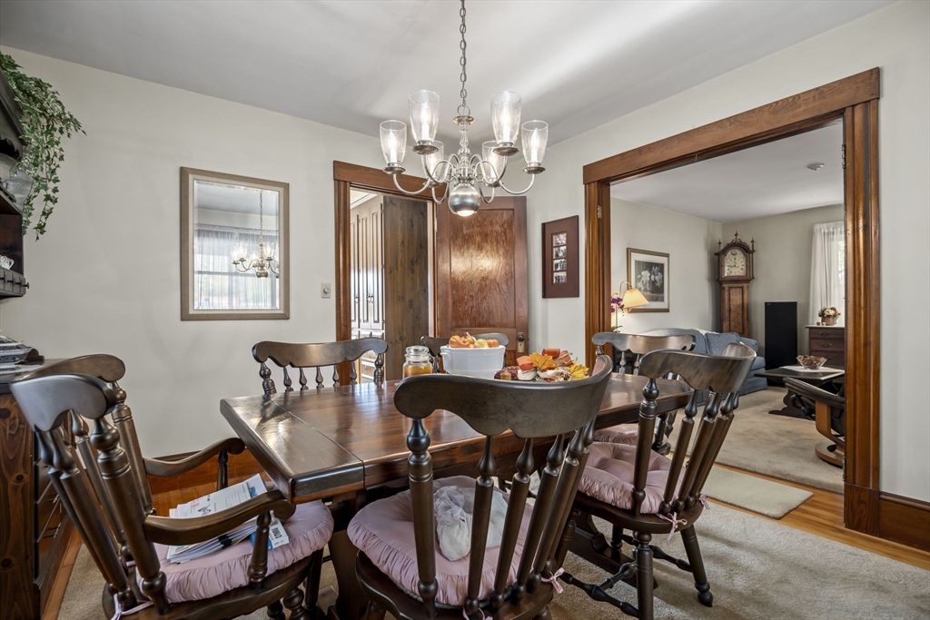 212 Elm Street Amesbury, MA 01913 - Photo 6 of 41 a view of a dining room with furniture and chandelier