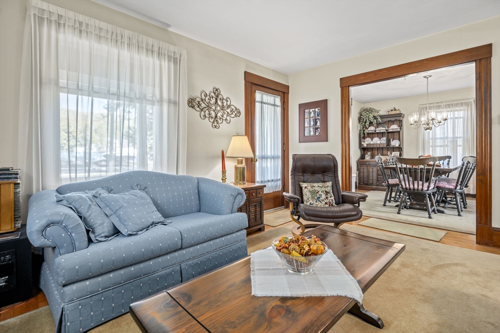 212 Elm Street Amesbury, MA 01913 - Photo 7 of 41 a living room with furniture and a large window
