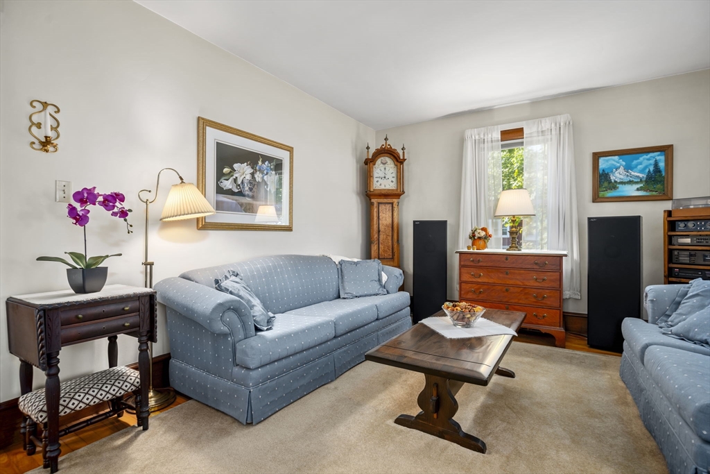 212 Elm Street Amesbury, MA 01913 - Photo 9 of 41 a living room with furniture and a potted plant