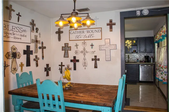 a view of a kitchen with furniture and chandelier