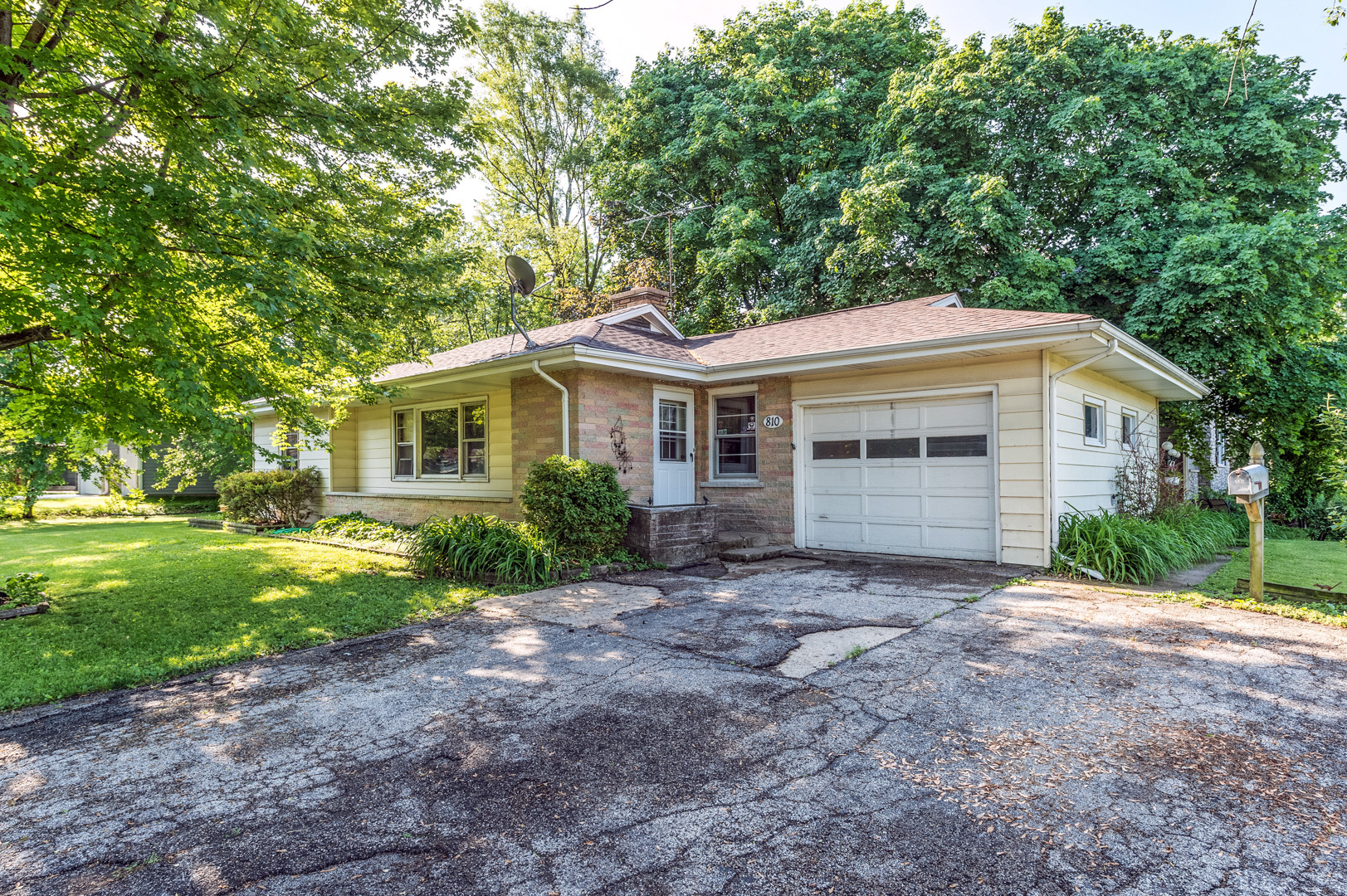 810 Parkside Road Naperville, IL 60540 - Photo 1 of 24 a front view of a house with a yard