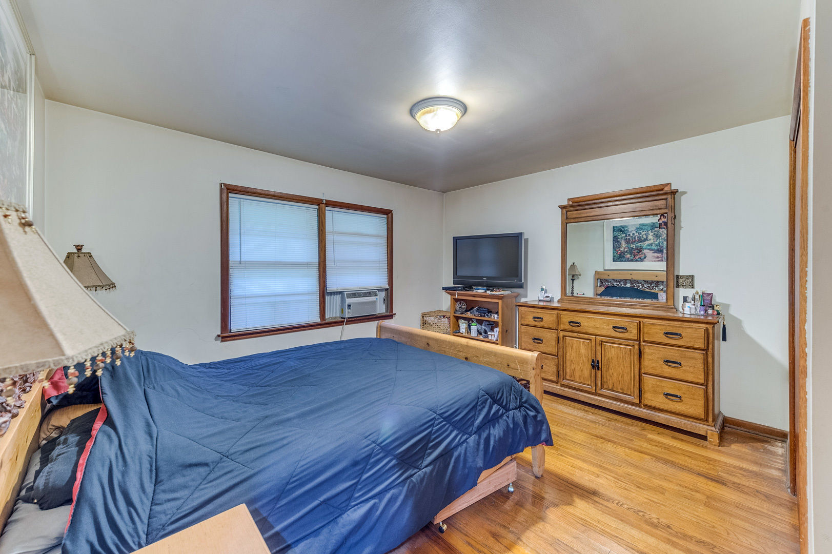 810 Parkside Road Naperville, IL 60540 - Photo 14 of 24 a bedroom with a bed and a flat screen tv