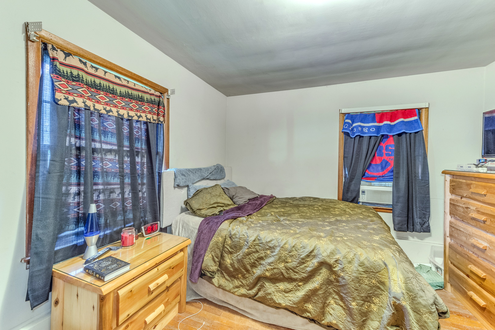 810 Parkside Road Naperville, IL 60540 - Photo 17 of 24 a bed sitting in a bedroom next to a window