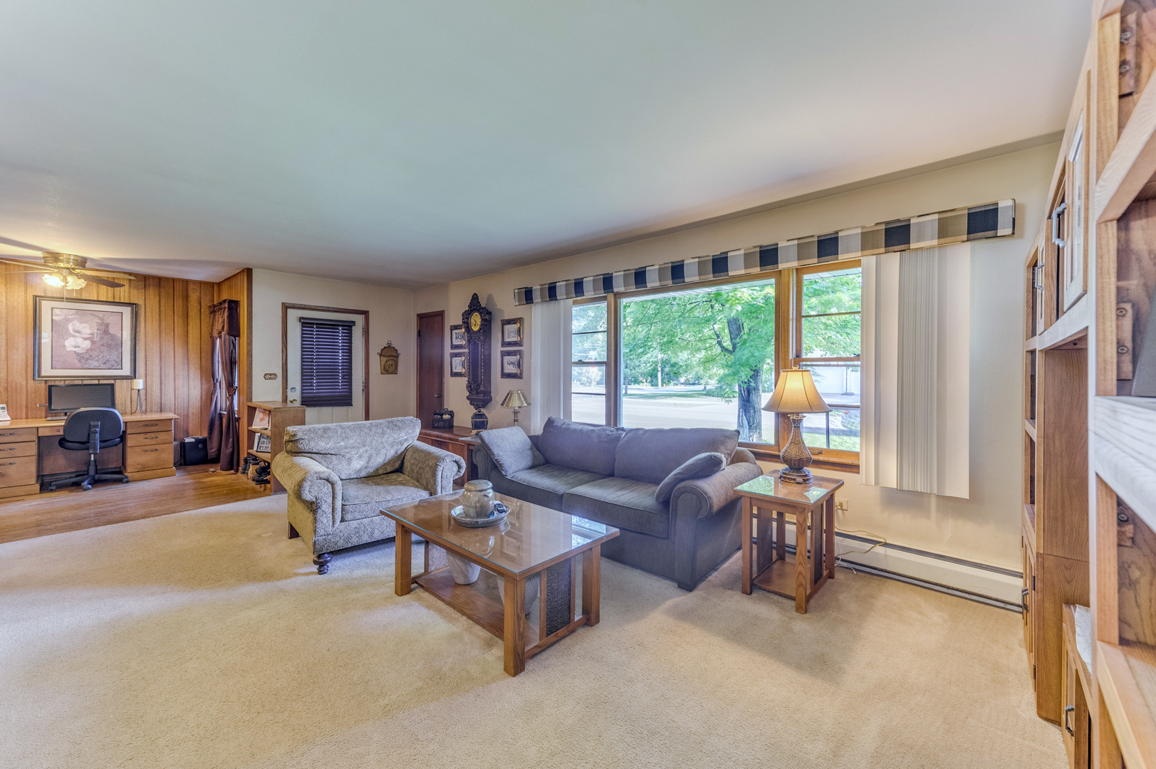 810 Parkside Road Naperville, IL 60540 - Photo 10 of 24 a living room with furniture and a large window