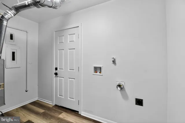 a view of a livingroom with wooden floor