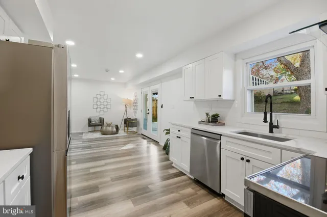 a kitchen with sink cabinets and window
