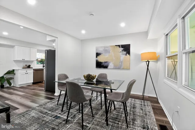 a view of a dining room with furniture and a rug