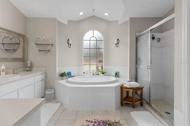 a spacious bathroom with a sink toilet and shower