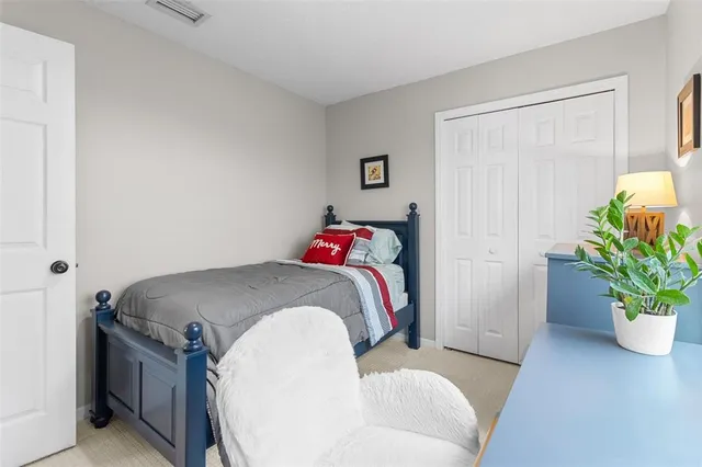 a en suite bathroom with a granite countertop tub and a potted plant