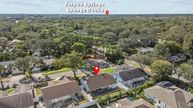 an aerial view of a house with a yard