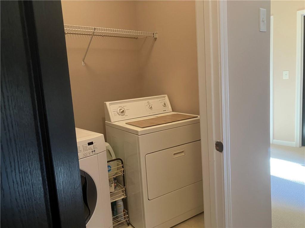 1665 Oakbrook Lake Drive Northwest Norcross, GA 30093 - Photo 12 of 24 a utility room with dryer and washer
