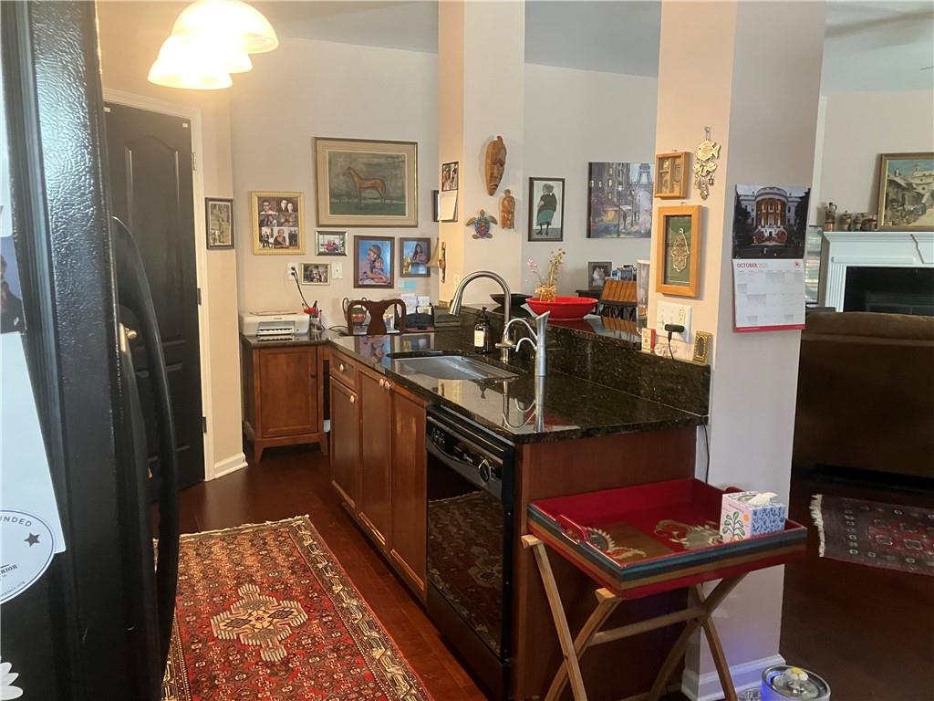 1665 Oakbrook Lake Drive Northwest Norcross, GA 30093 - Photo 17 of 24 a kitchen with a stove refrigerator and sink