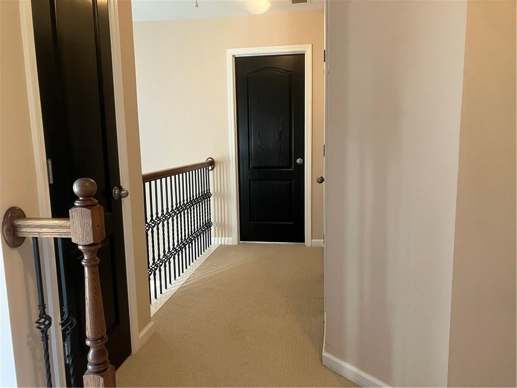 1665 Oakbrook Lake Drive Northwest Norcross, GA 30093 - Photo 18 of 24 a view of a hallway