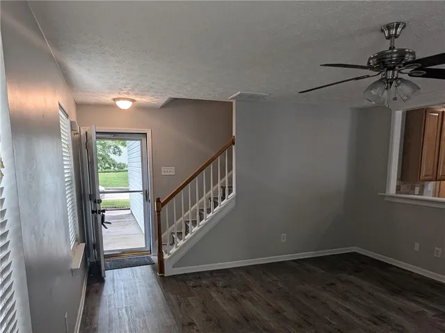 a view of entryway with wooden floor