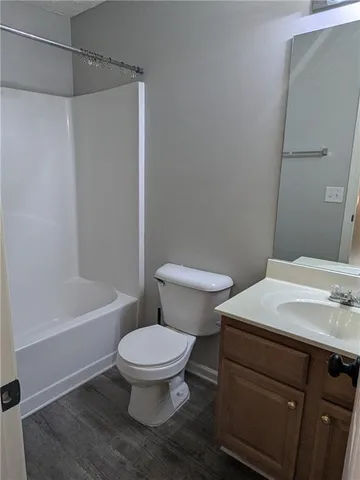 a bathroom with a sink a toilet and a bathtub