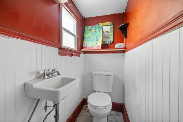 a bathroom with a glass shower door and mirror