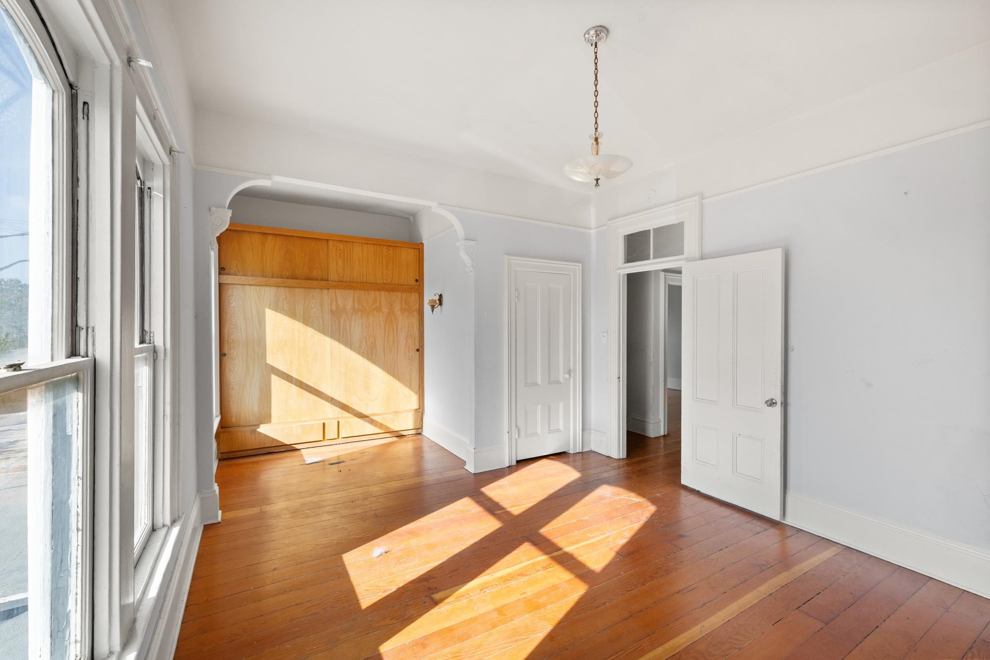 1746 8th Street Oakland, CA 94607 - Photo 20 of 52 a view of a room with wooden floor and windows