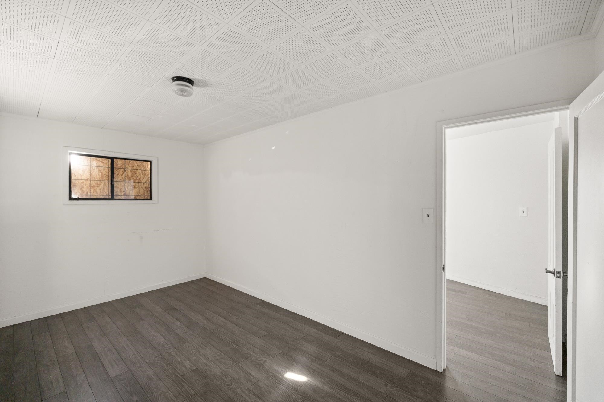 1746 8th Street Oakland, CA 94607 - Photo 43 of 52 a view of a room with wooden floor and white walls